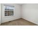 Vacant bedroom featuring neutral paint, carpet floors, a window, and baseboard trim at 3974 W 118Th Pl, Westminster, CO 80031