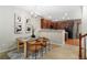 Cozy dining area with a modern chandelier and adjacent kitchen, ideal for entertaining and Gathering meals at 3974 W 118Th Pl, Westminster, CO 80031