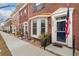 Brick townhome exterior featuring a bay window, walkway and well-maintained lawn at 3974 W 118Th Pl, Westminster, CO 80031