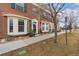 Brick townhome exterior featuring a bay window, walkway and well-maintained lawn at 3974 W 118Th Pl, Westminster, CO 80031