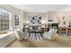 Cozy living room featuring a fireplace, stylish seating, and a bright bay window with a cushioned seat at 3974 W 118Th Pl, Westminster, CO 80031