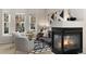 Bright living room with a fireplace, stylish seating, and a bay window, perfect for relaxing and entertaining at 3974 W 118Th Pl, Westminster, CO 80031