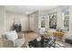 Bright living room with neutral colors, featuring a cozy seating area and a bay window offering natural light at 3974 W 118Th Pl, Westminster, CO 80031
