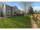 Well-manicured lawn and stone path connect the homes in this vibrant community at 10900 Parker Vista Rd, Parker, CO 80138