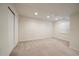 Finished basement space with carpeting, recessed lighting, and closet storage at 10900 Parker Vista Rd, Parker, CO 80138