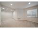 Finished basement with neutral carpet, recessed lighting, and a window at 10900 Parker Vista Rd, Parker, CO 80138