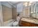 Bathroom featuring a shower-tub combination, granite countertop, and ample lighting at 10900 Parker Vista Rd, Parker, CO 80138