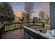 Relaxing deck area with outdoor seating offering serene views of the backyard and beyond at 10900 Parker Vista Rd, Parker, CO 80138