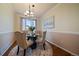 Elegant dining room featuring a round table, upholstered chairs, and a decorative rug at 10900 Parker Vista Rd, Parker, CO 80138