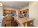 Lovely kitchen boasts granite counters, stainless appliances, and a breakfast bar, seamlessly connected to a cozy dining area at 10900 Parker Vista Rd, Parker, CO 80138