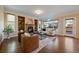 Bright living room boasts a fireplace, built-in shelves, large windows, and comfortable seating, perfect for relaxation at 10900 Parker Vista Rd, Parker, CO 80138