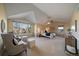 Spacious main bedroom with vaulted ceilings, large windows, and comfortable seating area at 10900 Parker Vista Rd, Parker, CO 80138