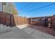 Private backyard featuring a concrete patio area enclosed by a tall wooden fence for added seclusion at 3738 Miller Ct, Wheat Ridge, CO 80033