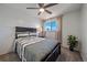 Bright bedroom with a large window, neutral-toned walls, and a comfortable bed with stylish linens and pillows at 3738 Miller Ct, Wheat Ridge, CO 80033