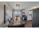 Bright dining area with modern furniture, opens to the kitchen and provides lots of light at 3738 Miller Ct, Wheat Ridge, CO 80033