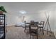 Cozy dining area with a modern table, comfortable seating, and stylish decor and modern lighting at 3738 Miller Ct, Wheat Ridge, CO 80033