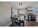 Dining area featuring modern lighting and sliding door to the exterior at 3738 Miller Ct, Wheat Ridge, CO 80033