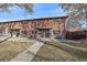 Charming brick townhome with well-manicured lawn and inviting front entrance at 3738 Miller Ct, Wheat Ridge, CO 80033