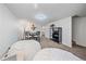 A stylish living room showcases a dining area, bean bag chairs, and modern decor and access to an updated bathroom at 3738 Miller Ct, Wheat Ridge, CO 80033