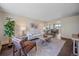 Inviting living room with modern furnishings and an open floor plan to the dining area at 3738 Miller Ct, Wheat Ridge, CO 80033