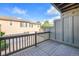 Balcony area with wood flooring and a view of surrounding houses at 8735 E 29Th Pl, Denver, CO 80238