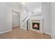 Bright living room with a fireplace and staircase at 8735 E 29Th Pl, Denver, CO 80238