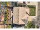 Birds-eye view of a home's roof, showing its design and roofing material, with the yard below at 6853 W Rockland Pl, Littleton, CO 80128