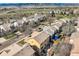 Panoramic aerial perspective of a neighborhood with mountain views, homes, and green spaces at 6853 W Rockland Pl, Littleton, CO 80128