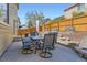 Backyard features a patio with an outdoor dining table and beautiful landscaping at 6853 W Rockland Pl, Littleton, CO 80128