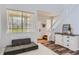 Entry way with wood flooring, white walls, and staircase with natural light at 6853 W Rockland Pl, Littleton, CO 80128