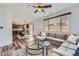Bright and airy living area with a large sectional and open floor plan to the kitchen at 6853 W Rockland Pl, Littleton, CO 80128