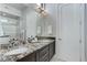 Bathroom featuring double sink vanity with granite countertop and modern fixtures at 2442 Champa St, Denver, CO 80205