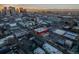 Aerial view showcasing the city's vibrant mix of residential and commercial buildings at sunrise at 2442 Champa St, Denver, CO 80205
