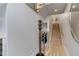 Bright foyer featuring hardwood floors, a modern coat rack, and stairs leading to the upper levels at 2442 Champa St, Denver, CO 80205