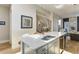 Bright kitchen features a large island, providing ample counter space and a modern aesthetic at 2442 Champa St, Denver, CO 80205