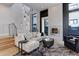 Elegant living room featuring high ceilings, large windows, a fireplace, and comfortable seating, perfect for entertaining at 2442 Champa St, Denver, CO 80205