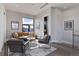 Comfortable living room with a large window offering city views and contemporary furnishings at 2442 Champa St, Denver, CO 80205