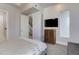 Inviting main bedroom with plush bedding, TV, and ensuite access at 2442 Champa St, Denver, CO 80205