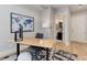 Bright office featuring hardwood floors, a large world map, and doorway view into the bath at 2442 Champa St, Denver, CO 80205
