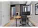 Stylish office with a modern desk setup, a cozy fireplace, and elegant decor touches at 2442 Champa St, Denver, CO 80205
