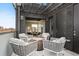 Inviting rooftop patio with comfortable seating, a fire pit, and access to the indoors at 2442 Champa St, Denver, CO 80205