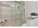 Tiled shower with glass door and built-in bench, complemented by sleek fixtures at 2442 Champa St, Denver, CO 80205