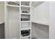 Walk-in closet offering ample storage space with built-in shelving and baskets at 2442 Champa St, Denver, CO 80205