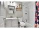 Bathroom features a white tile shower, a modern vanity, and stylish fixtures at 4309 S Coors Ct, Morrison, CO 80465