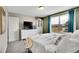 Bedroom with a neutral color palette, comfortable carpeting, and a large window at 4309 S Coors Ct, Morrison, CO 80465