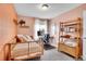 Charming bedroom featuring a cozy bed, desk, and stylish shelving unit at 4309 S Coors Ct, Morrison, CO 80465