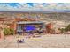 A sunny daytime view of the iconic Red Rocks Amphitheatre at 4309 S Coors Ct, Morrison, CO 80465