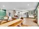 Bright, open-concept kitchen features stainless steel appliances and a breakfast bar, open to the dining room at 4309 S Coors Ct, Morrison, CO 80465