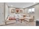 Comfortable living room with a sectional sofa, stylish coffee table, and movie posters at 4309 S Coors Ct, Morrison, CO 80465