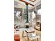 Bright sunroom features a modern fireplace, skylights, a spiral staircase, and glass table at 4309 S Coors Ct, Morrison, CO 80465